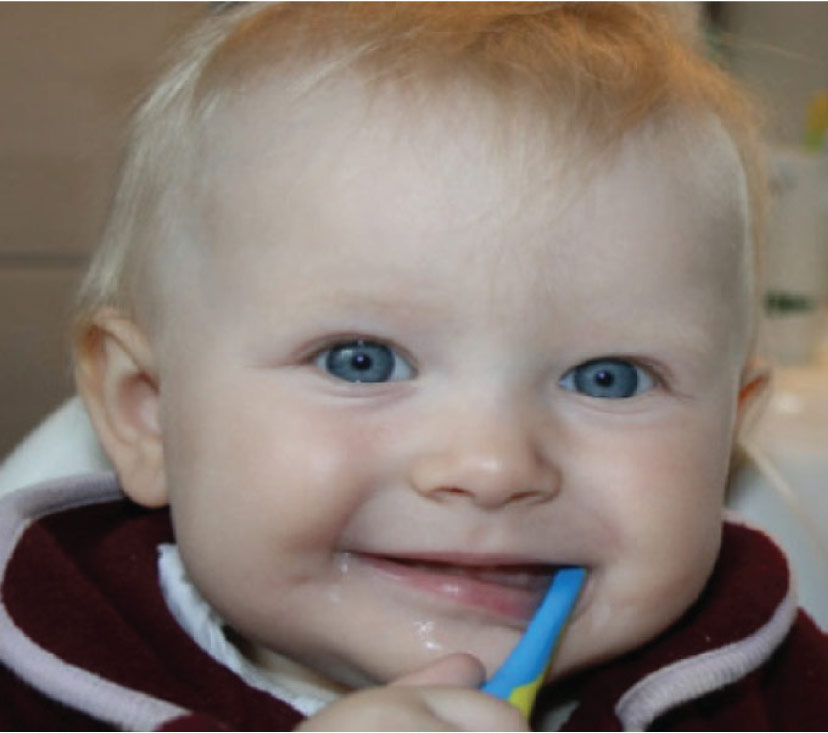 Baby boy with a toothbrush in his mouth dentist in euless