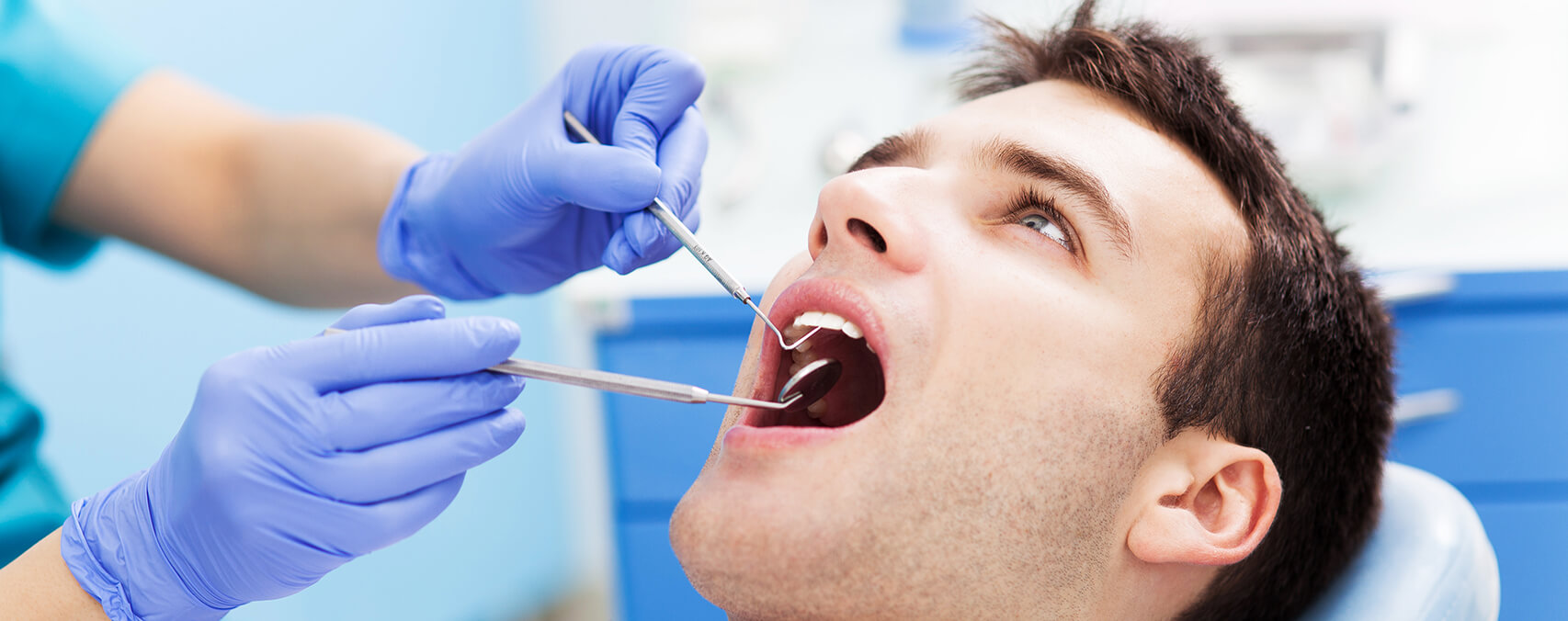 man receiving a dental exam